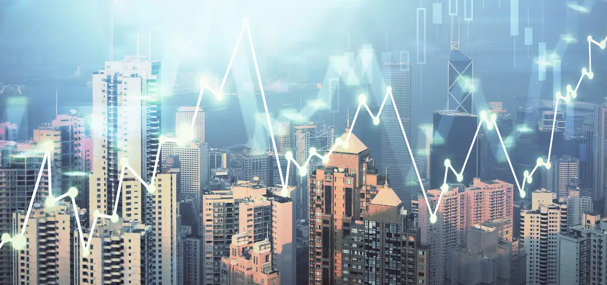 Volatile finance graph with high-rise backdrop