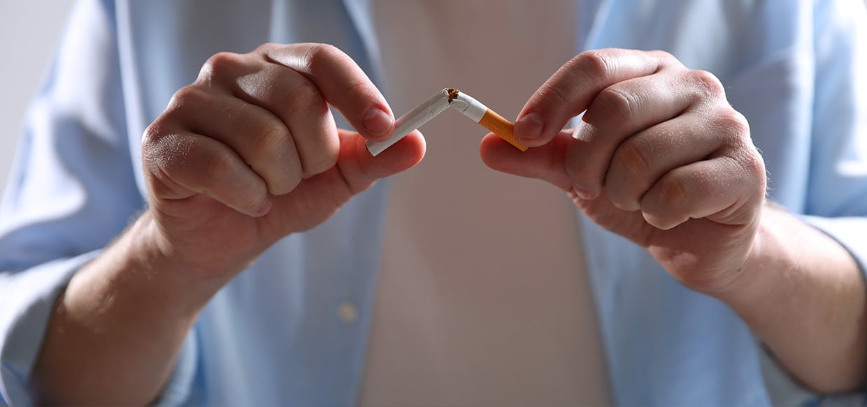 Person snapping a cigarette 